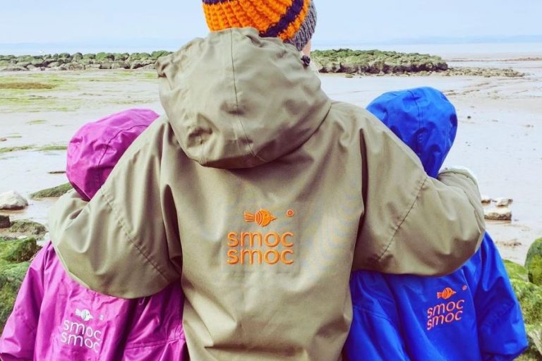 Smoc Smoc clothing - image of people wearing the smocs at a beach