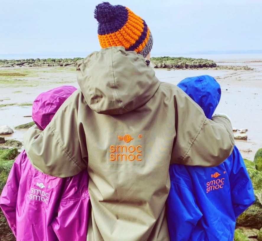 Smoc Smoc clothing - image of people wearing the smocs at a beach