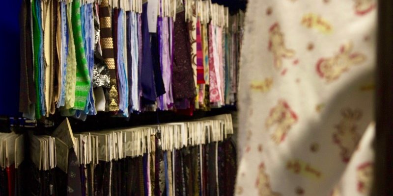 fabric hanging in racks
