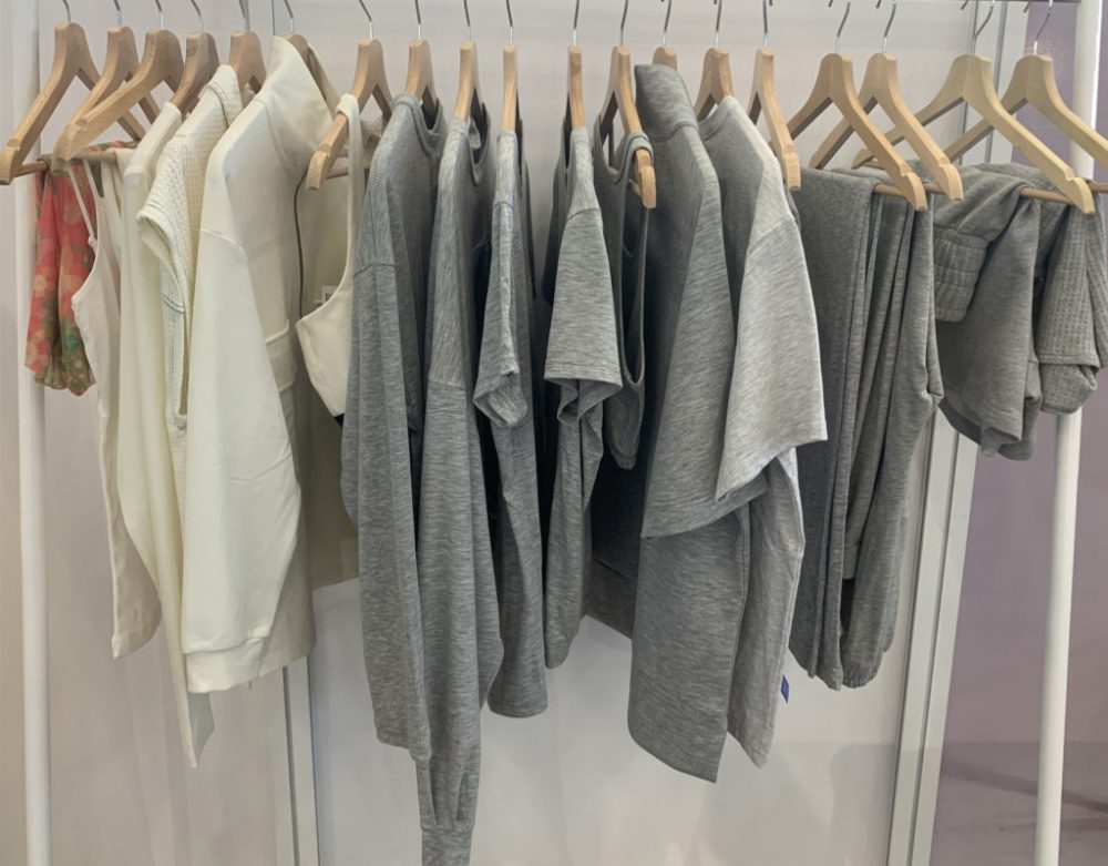 rack of tshirts and other clothing - grey and cream