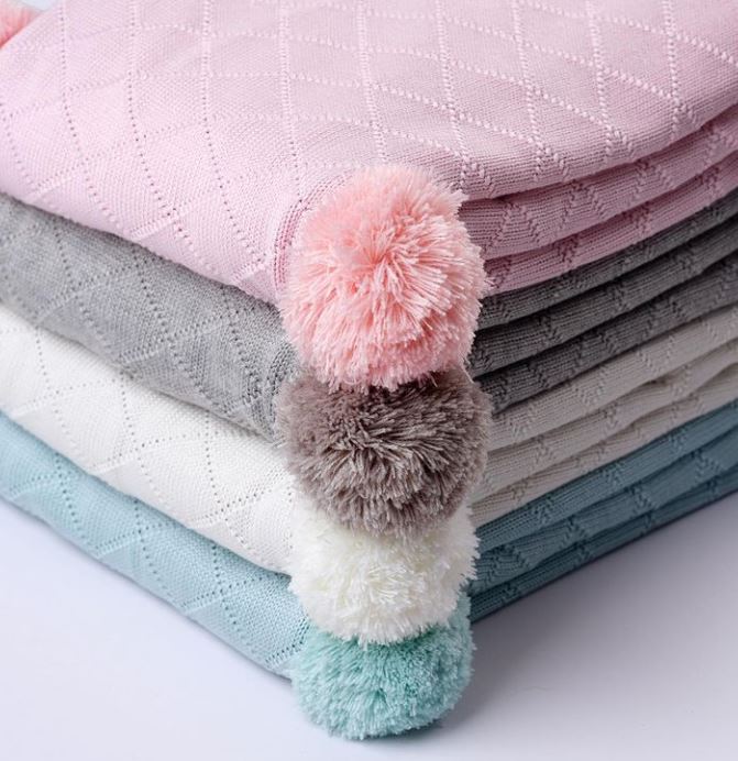 Silversnug knitted blankets with pom poms