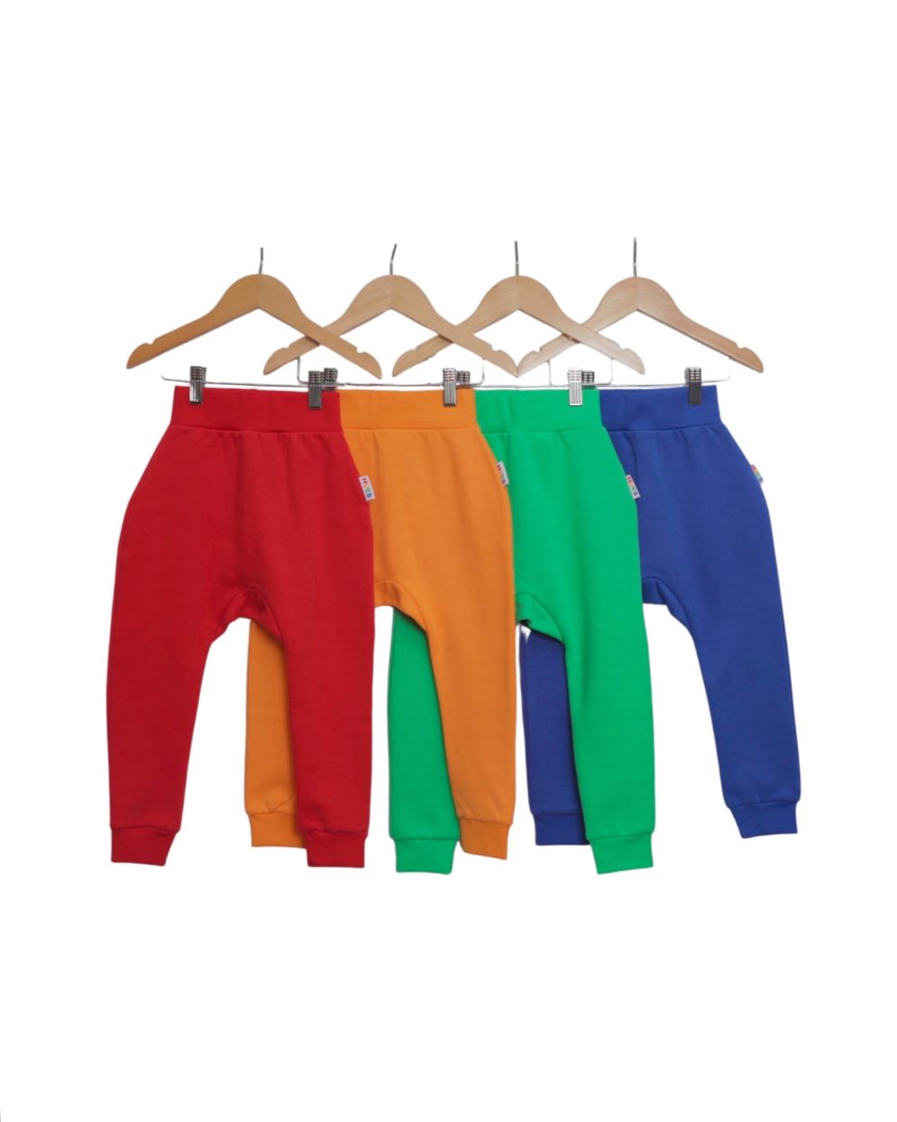 red, orange, green, blue Hues Clothing joggers on hangers