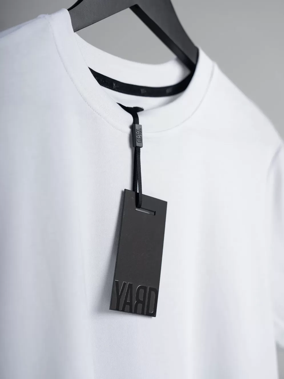 YD OF OVTM WHT swing tag 2k